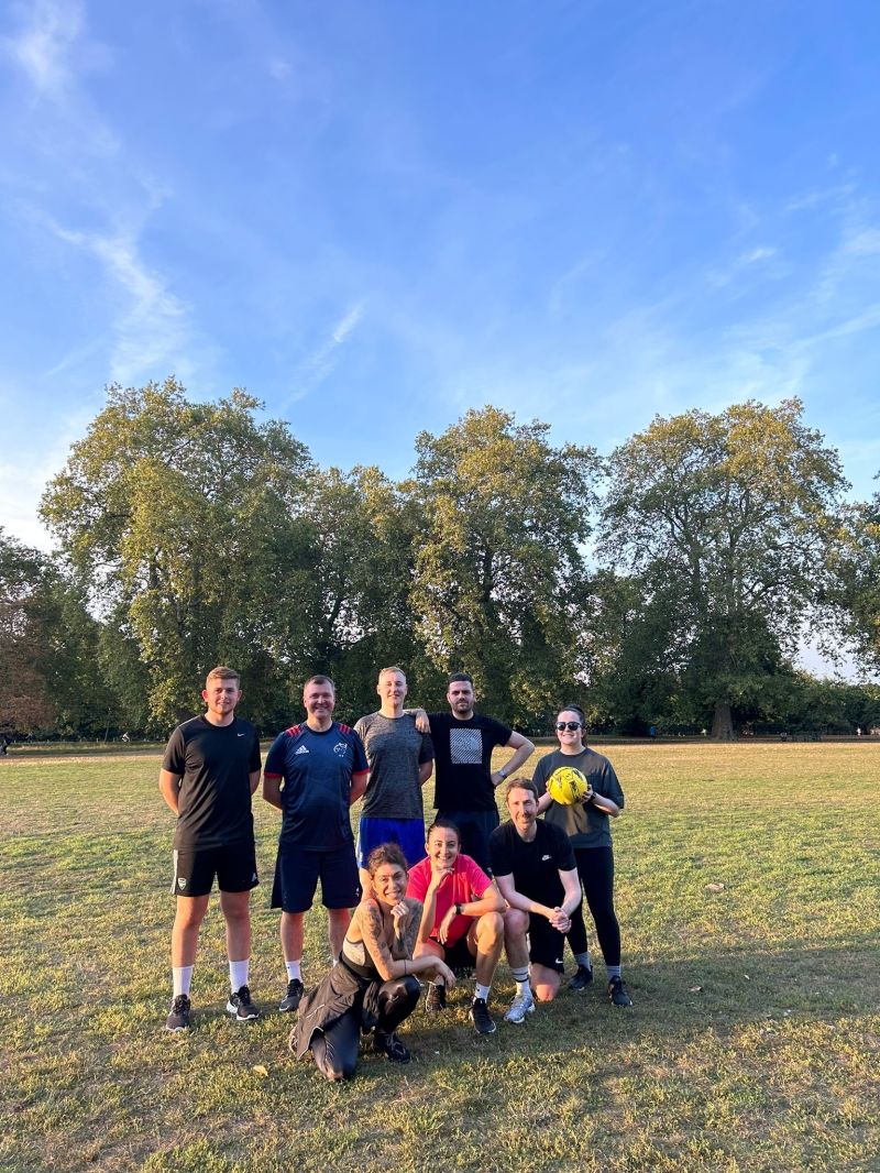 The team out playing a game of football in Hyde park