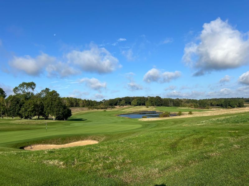 A lake and green at a golf club